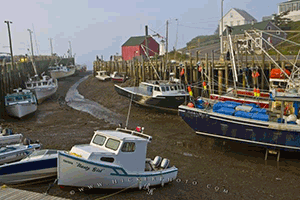 Image showing boats on the sea floor at low tide in bay of fundy.
